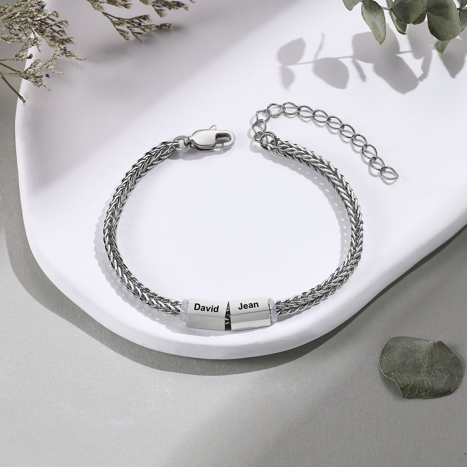 Silver wheat-chain family bracelet with two engraved name charms reading David and Jean