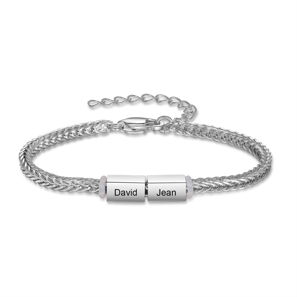 Close-up of a silver family bracelet charm engraved with the names David and Jean